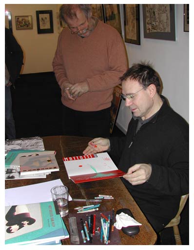 Lorenzo Mattotti signing his work in Lambiek (with Kees Kousemaker)
